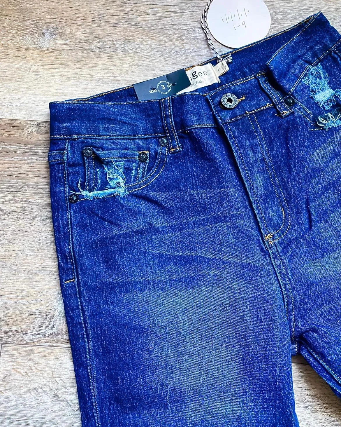 Dark Wash Tapered Denim Jeans with Distressed Ankle